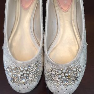 Hand decorated lace shoes.